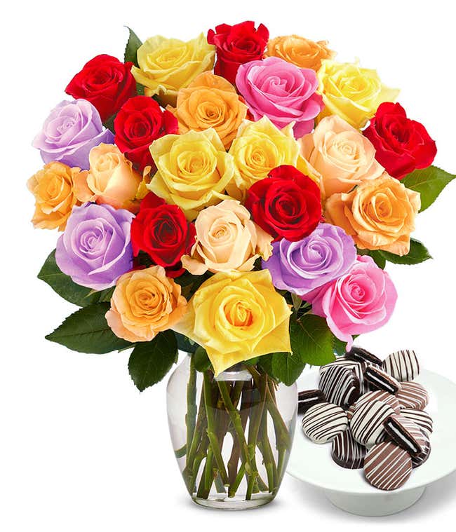 Two Dozen Rainbow Roses bouquet with a dozen Drizzle Chocolate Covered Oreos, optional glass vase, and personalized card message.