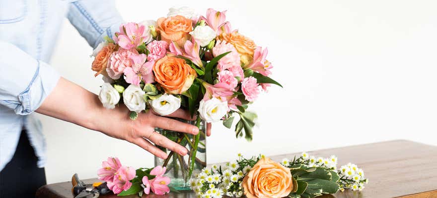 Florist designing a summer floral arrangement