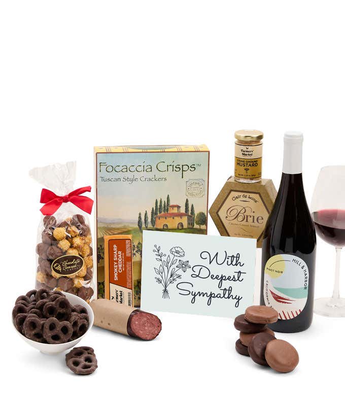 A gift set with a bottle of California Pinot Noir, focaccia crisps, two cheeses, mustard, summer sausage, caramel popcorn, chocolate pretzels, six chocolate-covered Oreos and a Sympathy card to show your support.