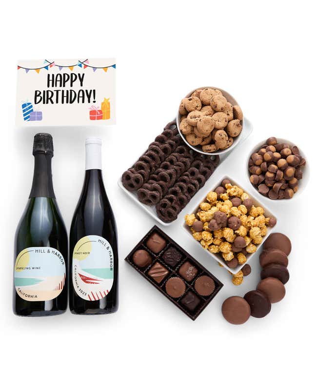 A gift set with 2 bottles of wine - red and sparkling, paired with chocolate pretzels, caramel popcorn, mini cookies, chocolate peanut butter buckeyes, six chocolate-covered Oreos, assorted chocolates, and a celebratory Birthday card.